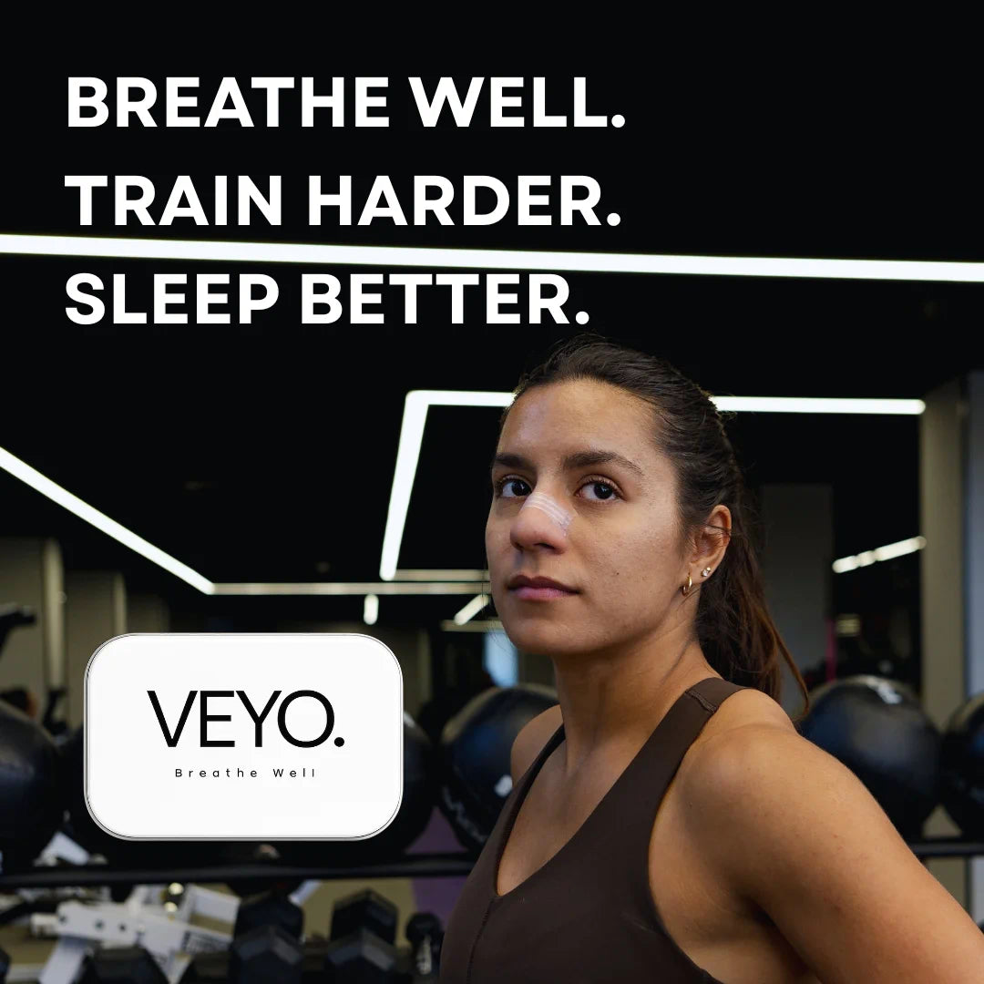 Woman using VEYO premium nasal strip in gym to breathe better and train harder