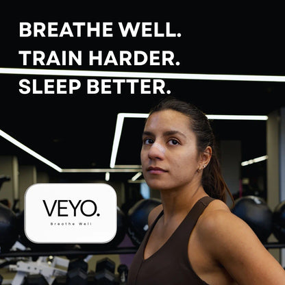 Woman using VEYO premium nasal strip in gym to breathe better and train harder